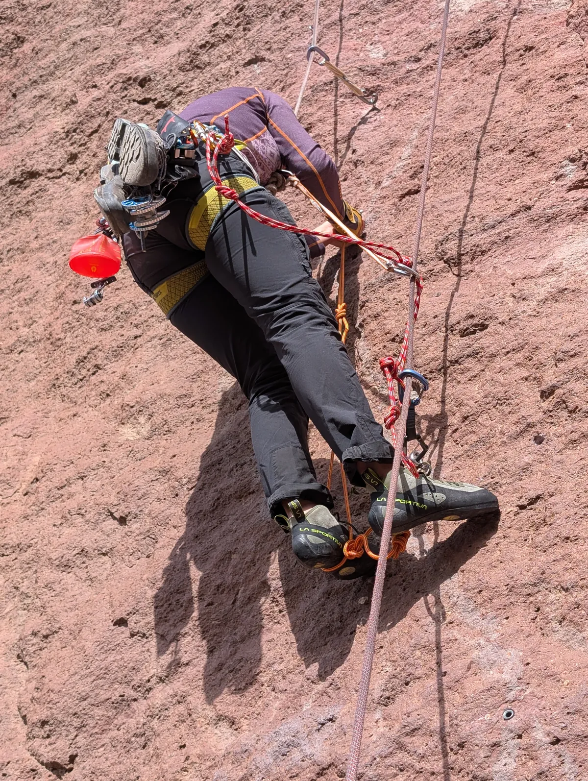 Chloe climbing the aid pitch.
